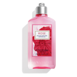 Rosa Duschgel in einer transparenten Flasche mit silbernem Verschluss und floraler Dekoration.