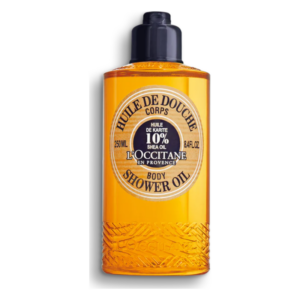 Flasche Duschöl mit 10% Sheabutter von L'Occitane, transparente gelbe Flüssigkeit, zylindrische Verpackung mit schwarzem Deckel.