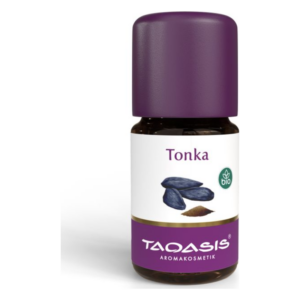 Braune Flasche mit lila Kappe und Etikett, das Tonkabohnen abbildet, biologisches Produkt von Taqasis.