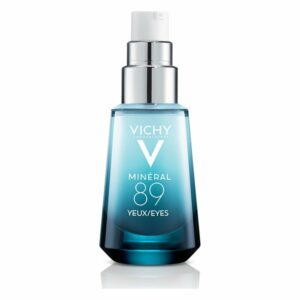 Flasche mit Vichy Mineral 89 Augenpflege, glasklares Design mit silbernem Pumpverschluss und blauer Flüssigkeit.