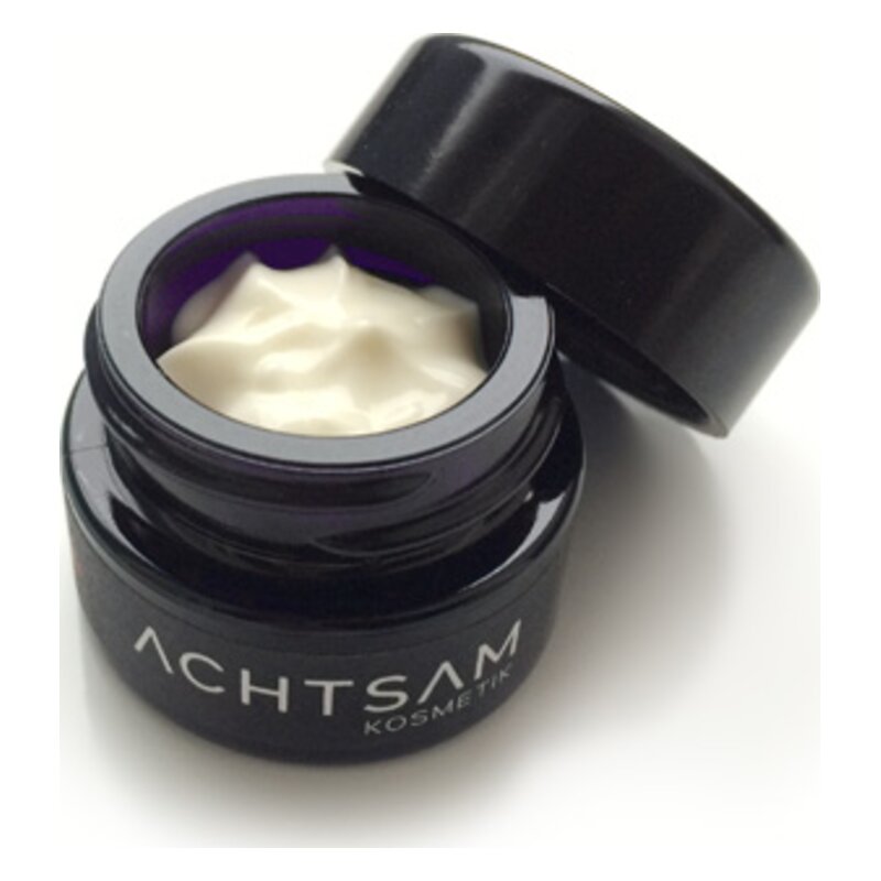Schwarzer Cremetopf mit weißer Creme und geöffnetem Deckel, beschriftet mit 'ACHTSAM KOSMETIK'.