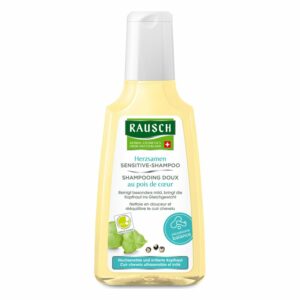 Flasche mit Rausch Herzsamen Sensitive-Shampoo, gelblich mit weißem Etikett und Spender, für sensible Kopfhaut.