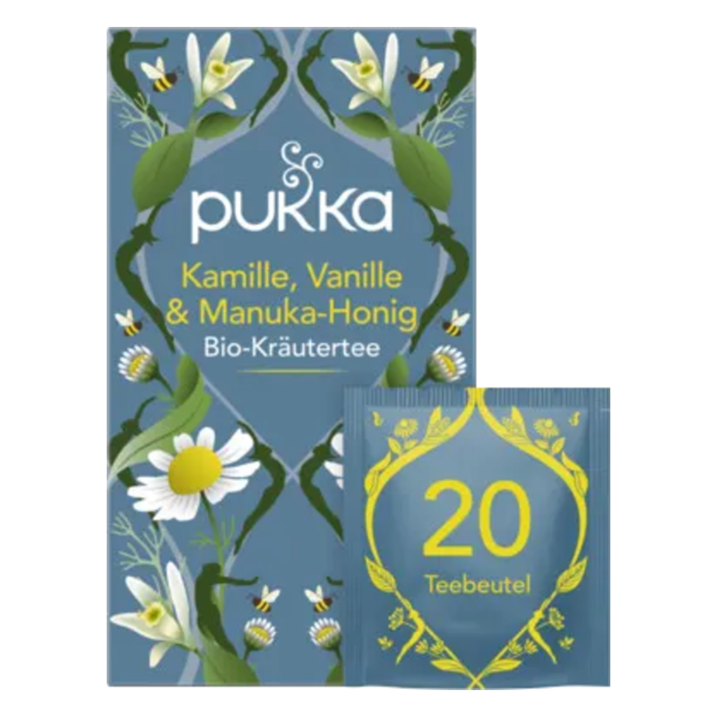 Verpackung von Pukka Bio-Kräutertee mit Kamille, Vanille und Manuka-Honig, zeigt einen Teebeutel und florale Elemente.