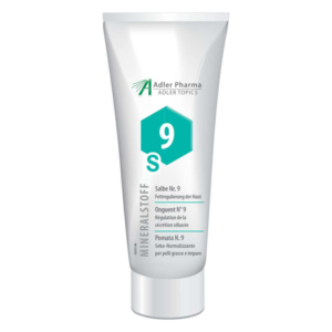 Eine Tube mit Salbe Nr. 9 zur Fettreduzierung der Haut, beschriftet mit verschiedenen Sprachen und einem hexagonalen Symbol.