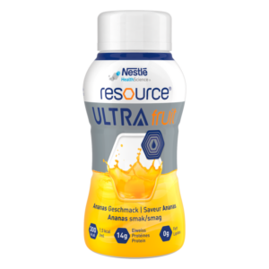 Flasche mit Ananasgeschmack, gelbes Getränk, 14g Protein, Verpackung von Nestlé, markante grafische Elemente.