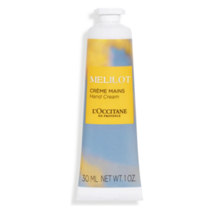 Handcreme in einer weißen Tube mit gelbem und blauem Etikett von L'Occitane.
