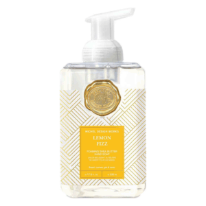 Flüssigseife in einem klaren Spender mit weiß-goldenem Muster und gelber Etikettierung, Duft Zitrone.