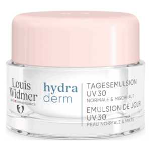 Tagesemulsion mit UV-Schutz in einem runden Glasbehälter mit pinkem Deckel, als Produkt von Louis Widmer.