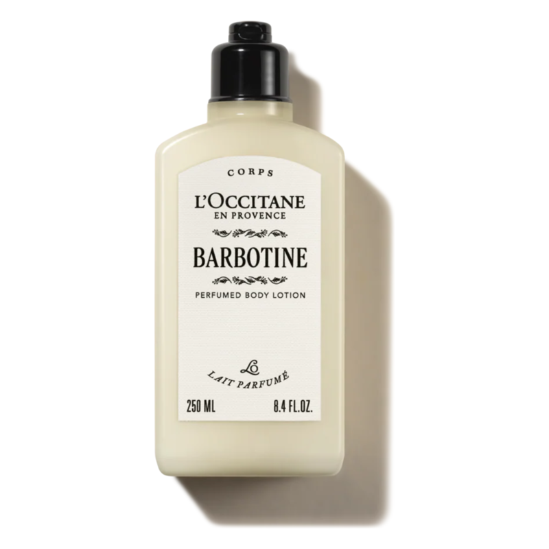 Flasche L'Occitane Barbotine Körperslotion mit schwarzem Verschluss und eleganter, cremefarbener Verpackung.