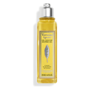 Transparente Flasche mit gelbem Duschgel, Etikett zeigt Verveine Agrumes und ein Blattmotiv.