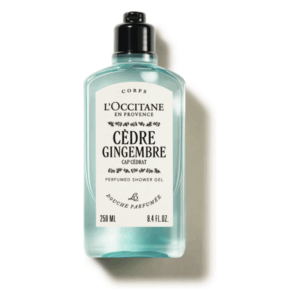 Flasche mit duschgel von L'Occitane, duftend nach Zeder und Ingwer, mit schwarzer Kappe und eleganter, transparenter Verpackung.