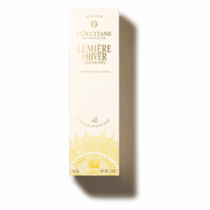 Verpackung einer Handcreme von L'Occitane mit goldenen Akzenten und dem Schriftzug Lumière d'Hiver.