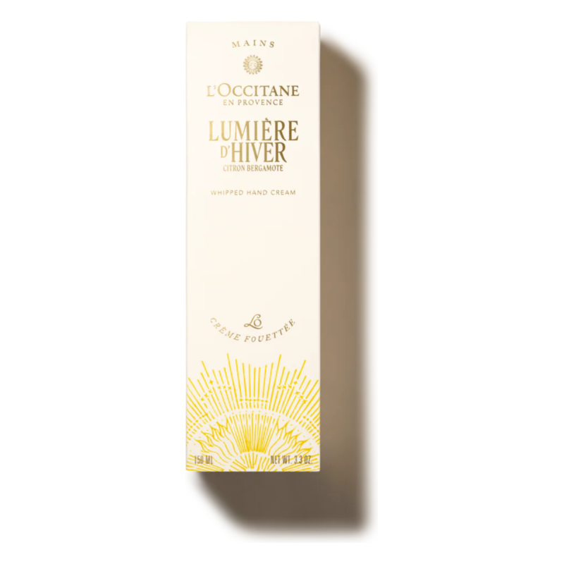 Verpackung einer Handcreme von L'Occitane mit goldenen Akzenten und dem Schriftzug Lumière d'Hiver.
