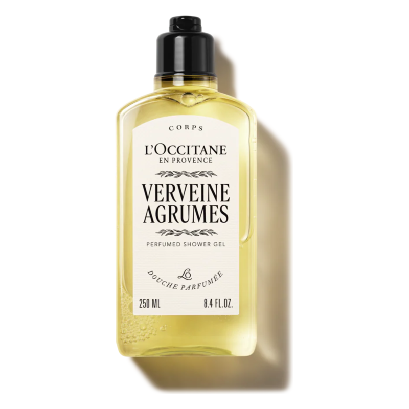 Transparente Flasche mit gelbem Duschgel von L'Occitane, etikettiert mit 'Verveine Agrumes'.