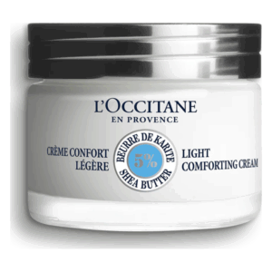 Weißes Glasgefäß mit schwarzem Deckel, enthält leichte Sheabutter-Creme von L'Occitane.