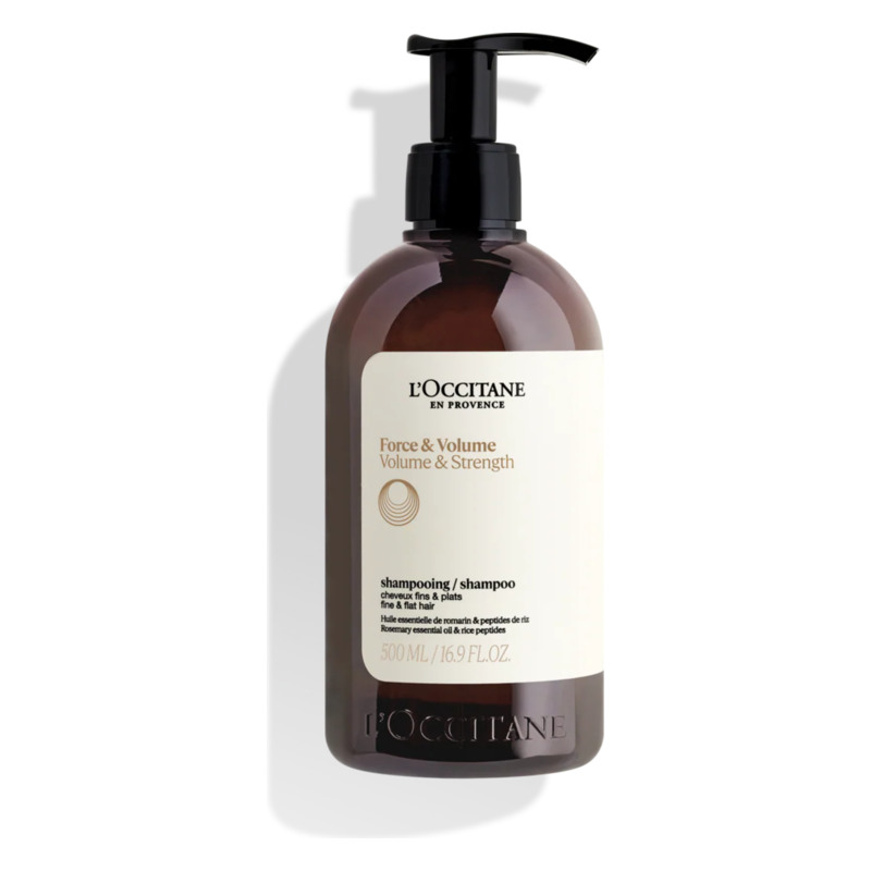 Braune Flasche mit Pumpe von L'Occitane für Shampoo, beschriftet mit "Force & Volume" und 500 ml Inhalt.