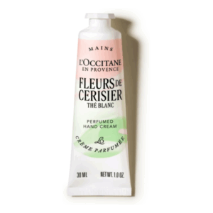 Handcreme in einer schlanken, kunstvoll gestalteten Tube mit floraler und pastellfarbener Hervorhebung