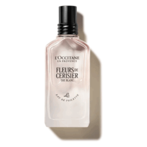 Flasche Eau de Toilette von L'Occitane mit rosa Flüssigkeit und schwarzem Deckel, etikettiert Fleurs de Cerisier.